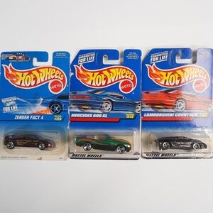 Vintage Hot Wheels‎ die-cast model cars, each sealed in original Mattel p…